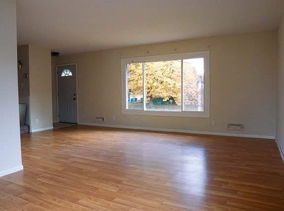 Large living room with lots of natural light