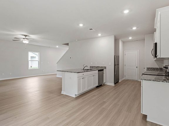 Dining area overlooks the kitchen