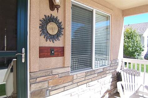 Exterior Front: Close-up of Covered Front Porch Area.