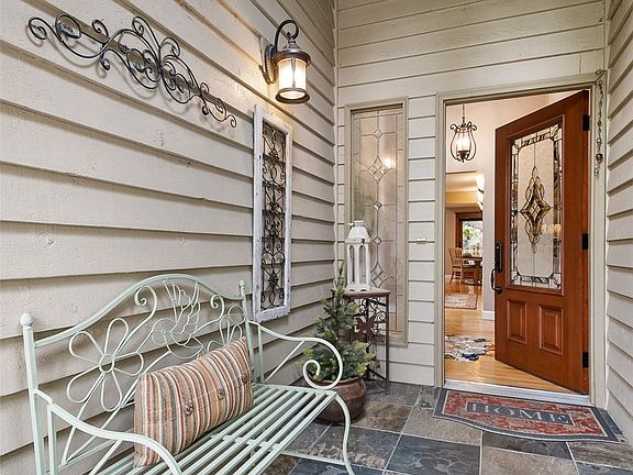 Covered front porch ... automatic lighting ... beautiful front door.>