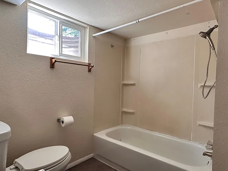 Basement bathroom has full tub