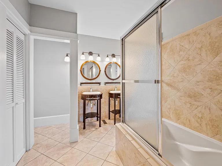 Double sink master bath with toilet closet.