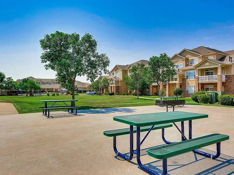 Open space with picnic tables and charcoal grills