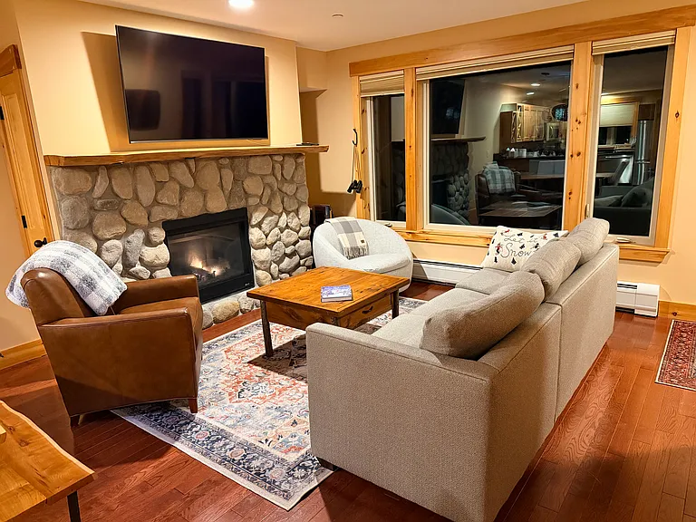 Living Room with 70 inch tv, gas insert fireplace, and great mountain views