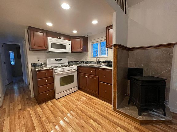 Kitchen has gas stove, oven microwave oven, stainless steel sink and refrigerator. Plenty of light!!