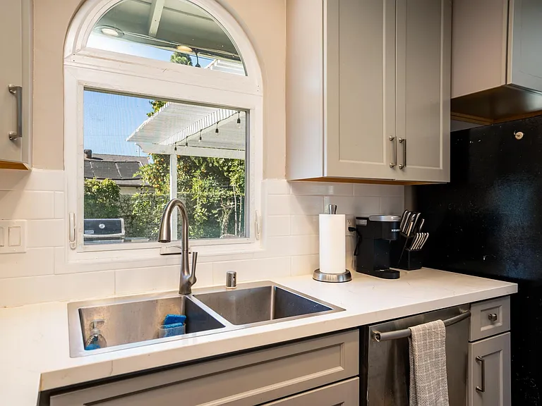 Quiet dishwasher. Window above sink looks out to lush backyard.