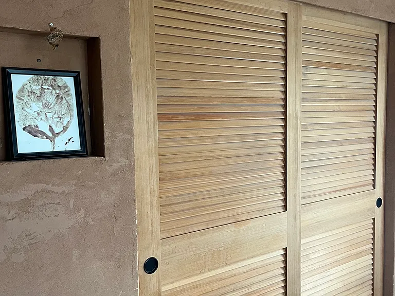 These are the closet doors in the larger bedroom plus a small decorative alcove built into the wall. The American Clay on the walls provides a soothing quality compared to most paint covered spaces.