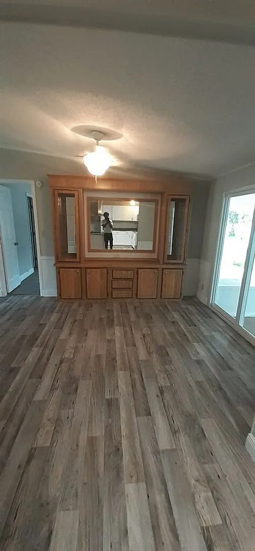 Remodeled 3 bed 2 bath 1,628 sq ft home with a large screen — Photo 4
