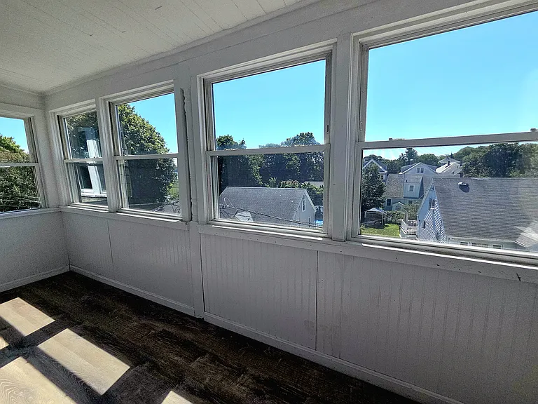 sundrenched porch enclosed for three or more seasons of use
