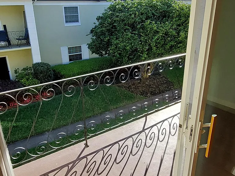 The slider off main room leads to the back porch that looks on to the courtyard.