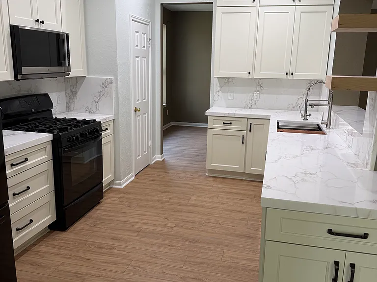 Kitchen has tons of storage and a separate pantry closet (back left door). Lots of counter space and easy access to sink and stove makes the flow of cooking very enjoyable.