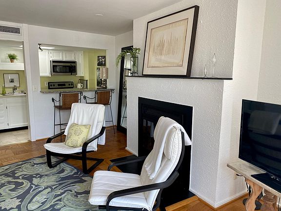 Cozy and charm surrounds this little spot near the fireplace. Kitchen fully furnished and skylight to keep it all light and bright.