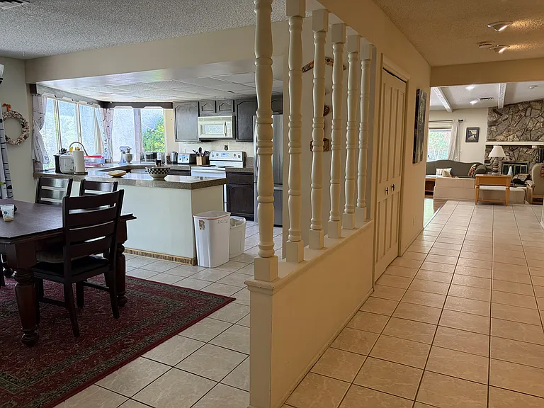 Dining area, kitchen and hallway to the living room