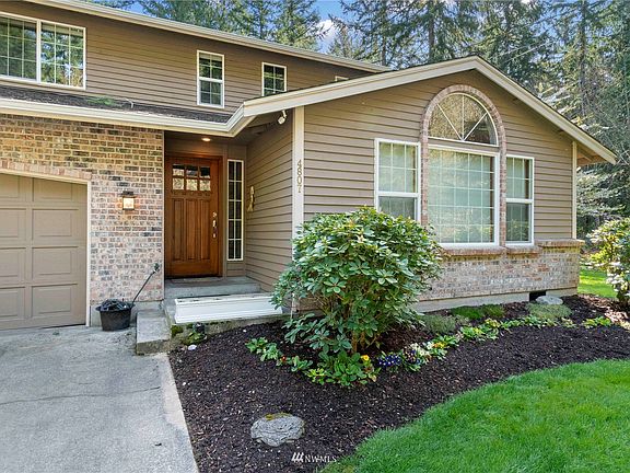 Covered patio greets you in this lovingly maintained home