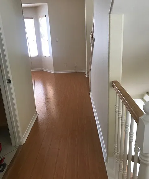 Downstairs hallway with powder room