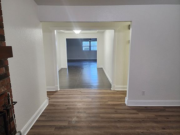 Front living room looking into center room then to Back living room.
