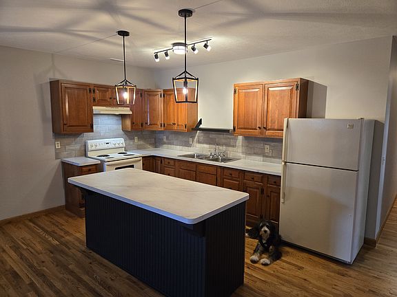 Roll out your pie crusts and cookie doughs on this extra large island or setup your buffet and share a meal here. __