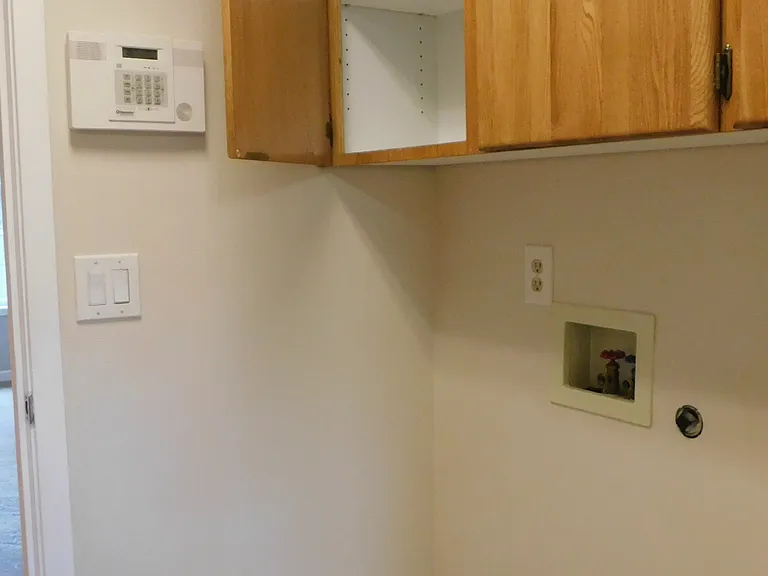 Laundry/mud room off garage with washer & dryer hookup and more storage!