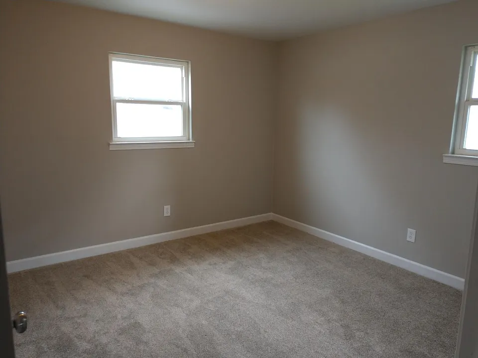 Bedroom 1 features new paint, and new carpet.