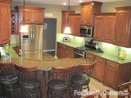 Kitchen
						:
						Custom cabinets, granite, stainless - walk in pantry just behind frig.