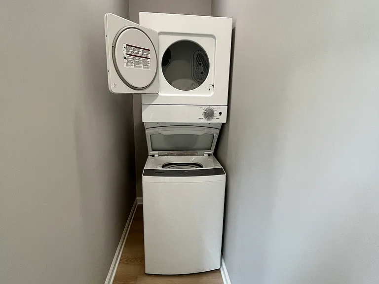 In-unit stacked washer and dryer.