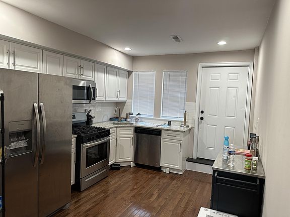 Kitchen with built-in microwave and stainless steel appliances