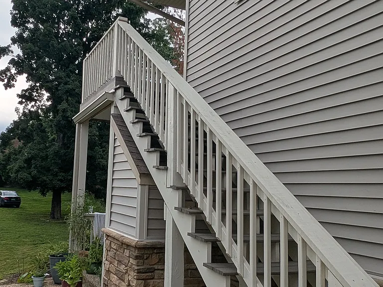 Private new exterior staircase leading to the upper-level entrance