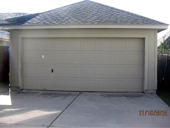 Detached Garage with covered walk area.