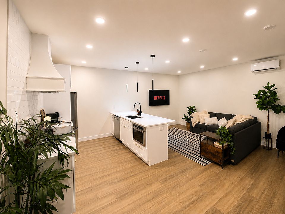 Fully Equipped Chef's Kitchen and Open Concept Living Room. Smart TVs in each room, with access to all your favorite streaming apps, including Netflix, Hulu, Disney+, Max, Prime Video, and YouTube (guests log in using their own accounts).