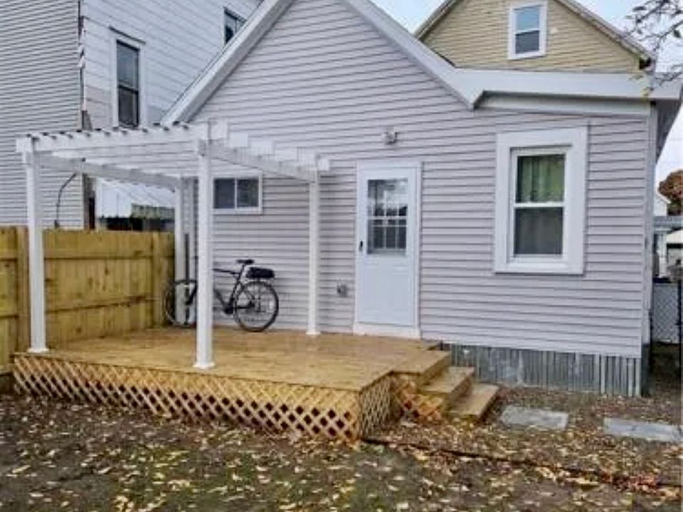 The rear 1 BDR unit has a private deck and fenced-in yard.