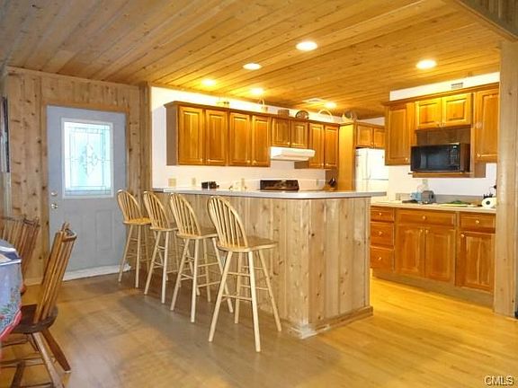 Updated friendly, open kitchen with walk-in pantry.