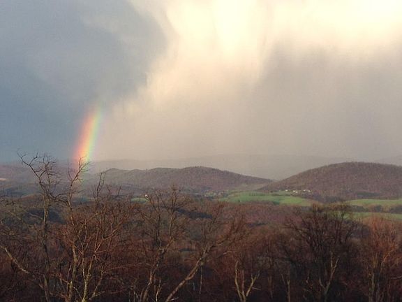 A rainbow separates the dark