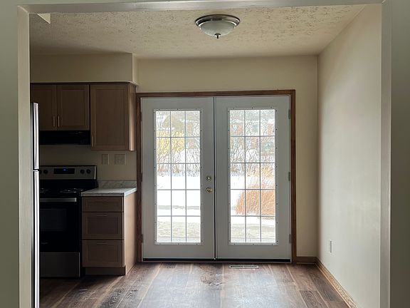 Dinette and French doors leading to concrete patio