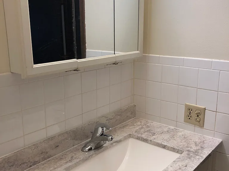 Updated bathroom vanity, sink, faucet, and medicine cabinet