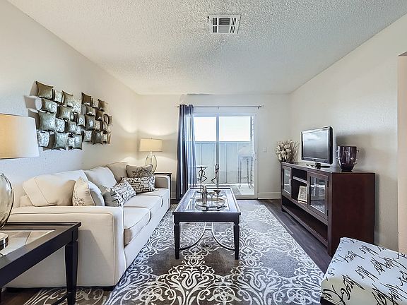 Step into this chic and inviting living room, perfect for relaxation and entertaining.