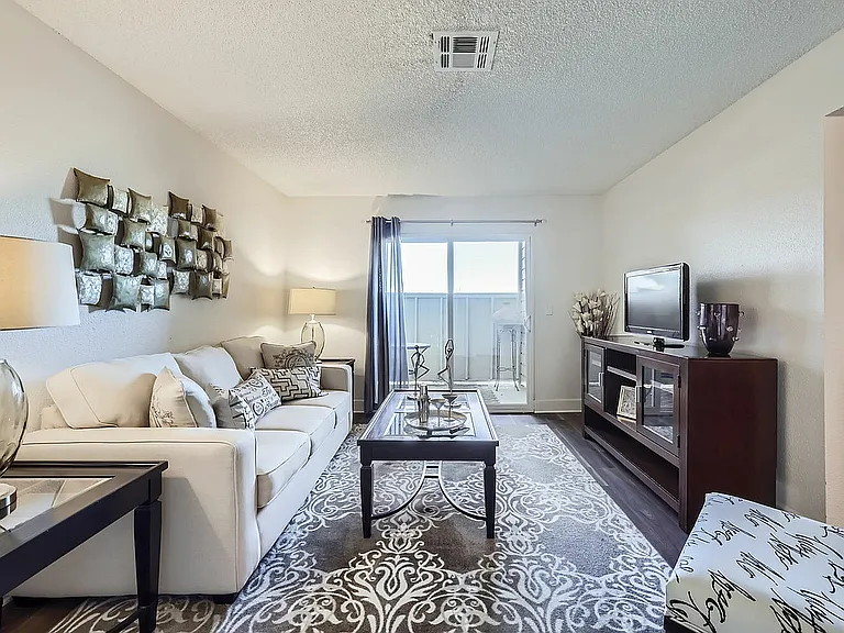 Step into this chic and inviting living room, perfect for relaxation and entertaining.