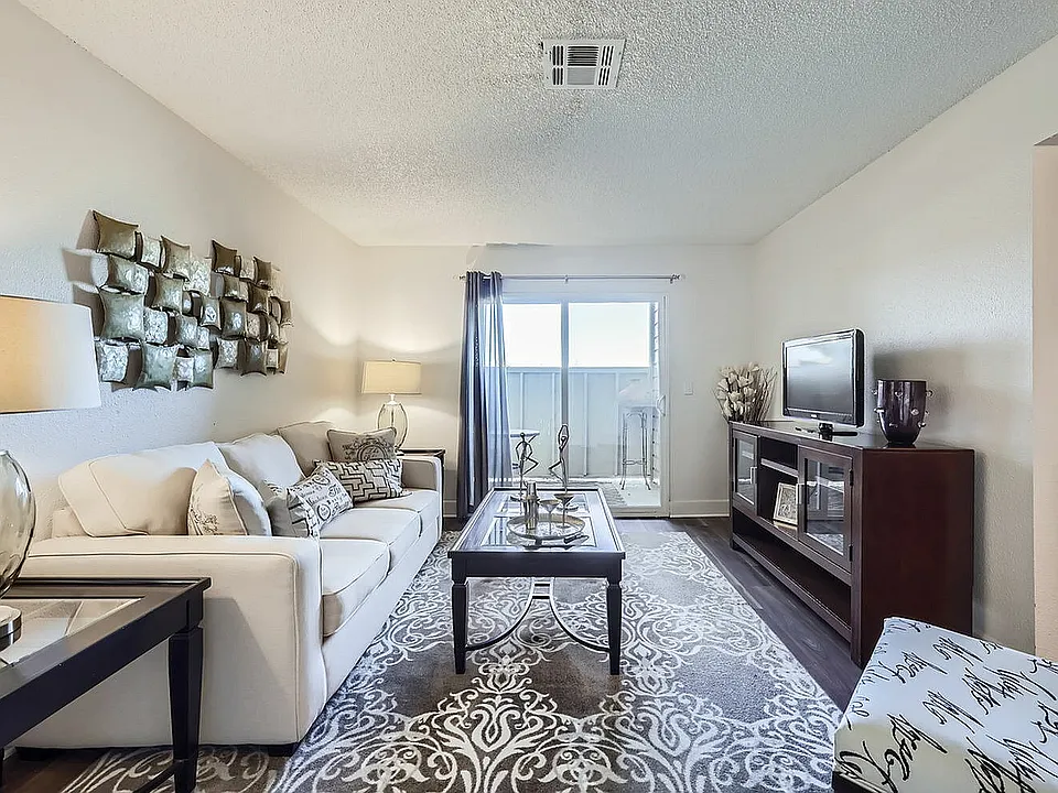 Step into this chic and inviting living room, perfect for relaxation and entertaining.