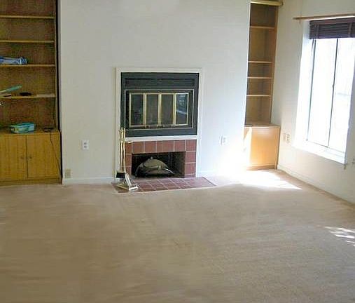 living room with working fireplace