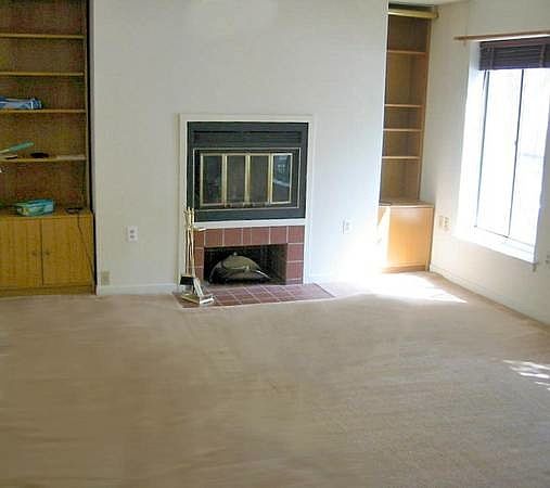 living room with working fireplace
