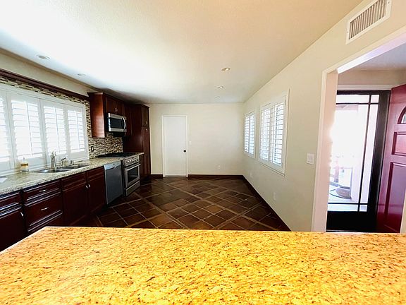 Large kitchen with oversized granite peninsula/island