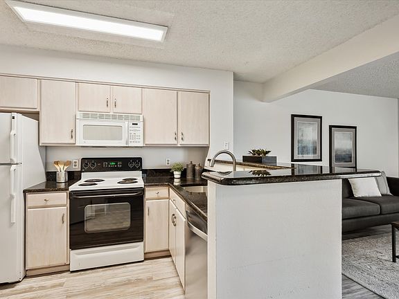 Kitchen with black countertops.