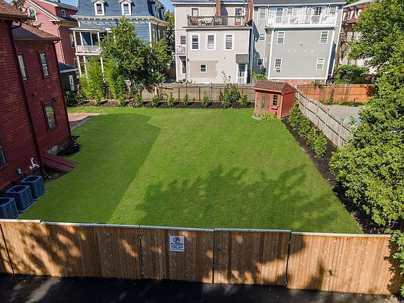 The "lawn" rimmed by "Green Giant" Arborvitae