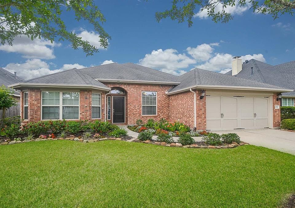 Begin your journey through the home with a beautiful entrance surrounded by an impressive landscape.