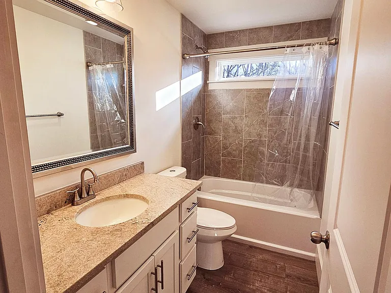 Bathroom with large vanity with lots of storage.