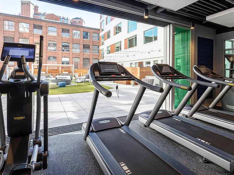Your fully equipped fitness center opens up to the central courtyard.