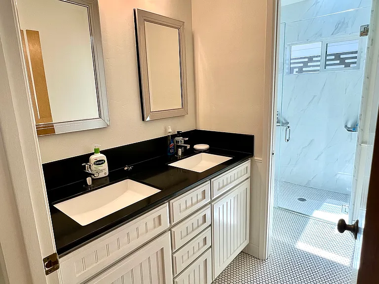 full bathroom with tasteful tiling and walk-in shower