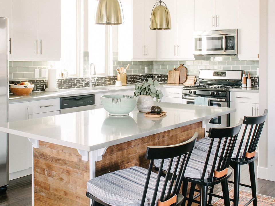 Open floor plan kitchen, with custom tile work and island.