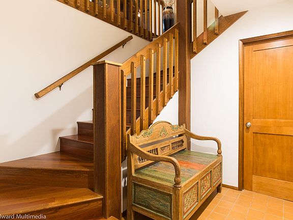 Entry way with stairs to living area. Utility room
