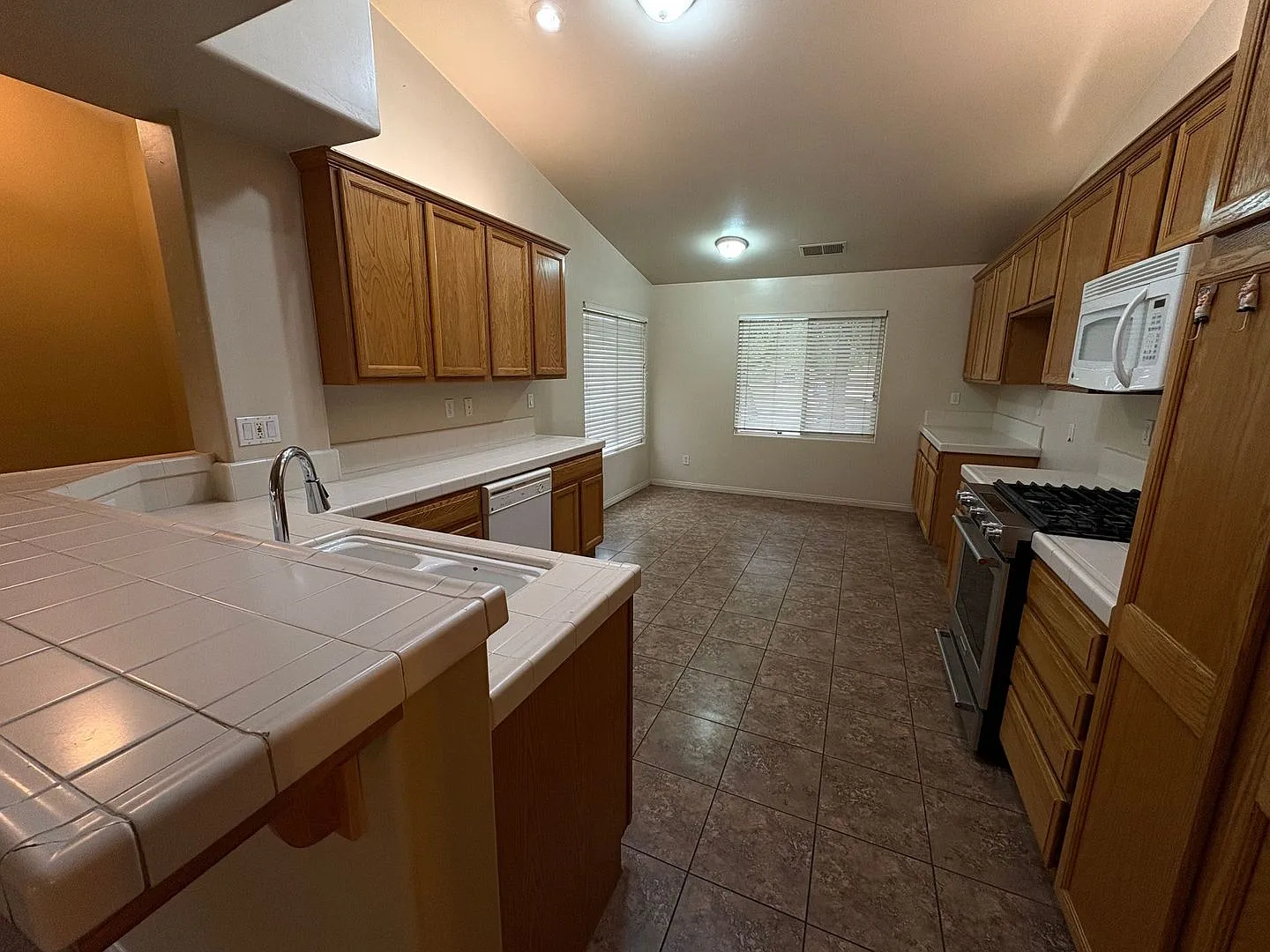 3 Bedroom Home with 2-Car Garage, Covered Patio & Gardening Included — Photo 3