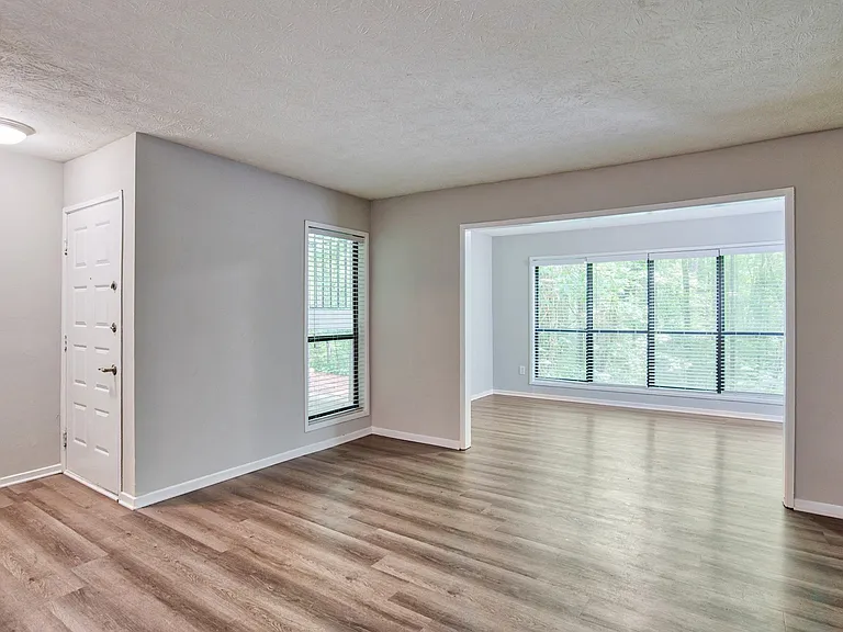 Living room with large floor to ceiling window